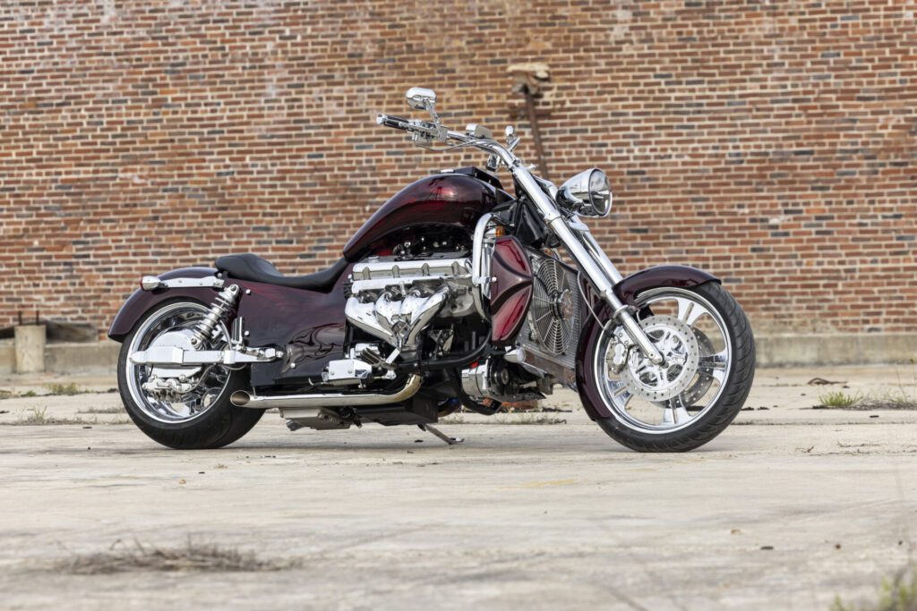 Improved rigidity from inverted suspension, vacuum body panels, cast framed components